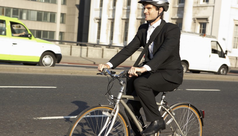 Businessman cycling to work