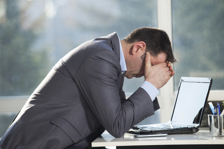 Worried business man sitting in the office